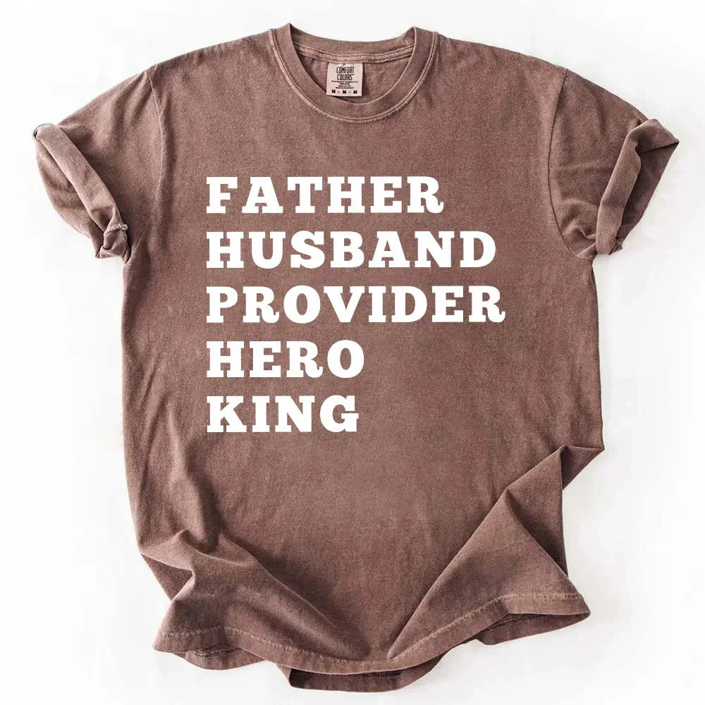 Mauve-brown crewneck T-shirt with stacked "FATHER HUSBAND PROVIDER HERO KING" print