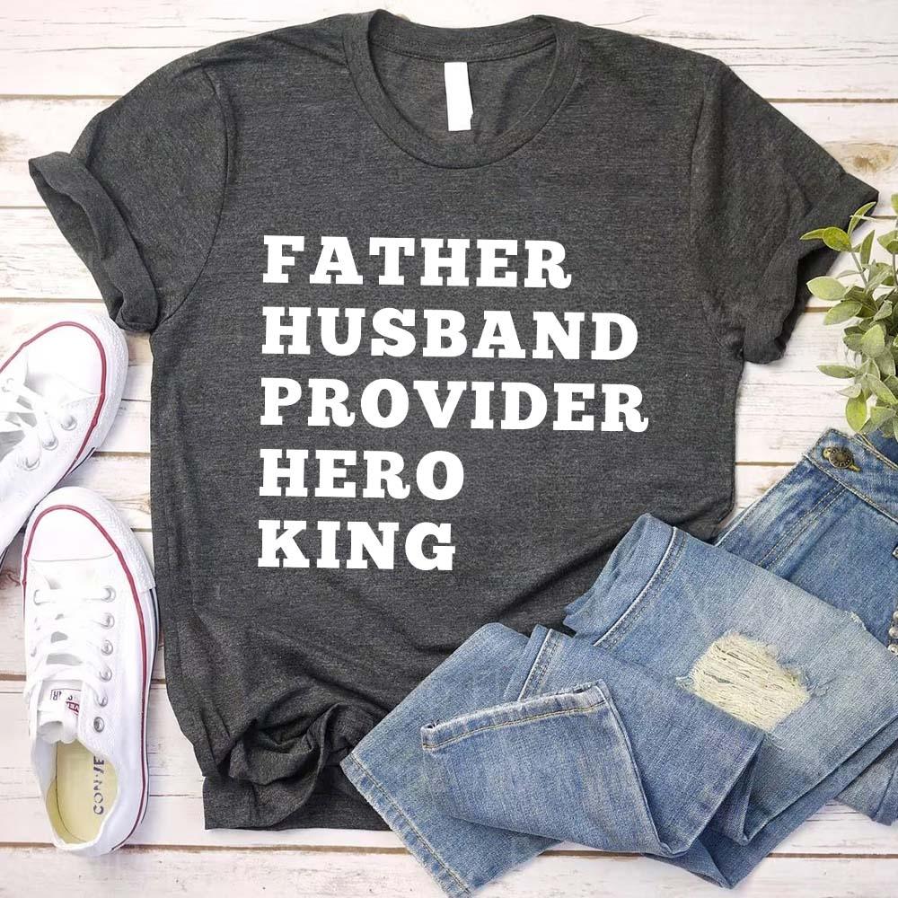 Dark gray crewneck T-shirt with stacked "FATHER HUSBAND PROVIDER HERO KING" print