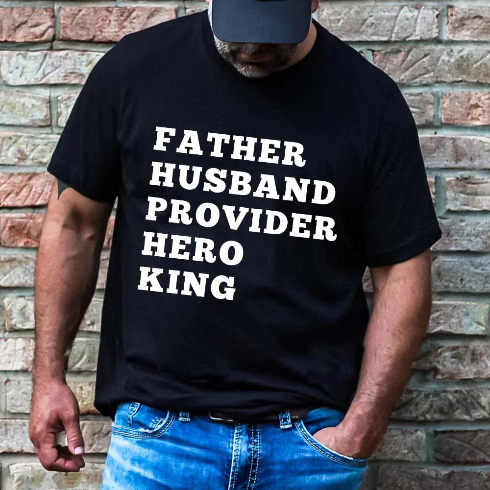 Black graphic T-shirt with white stacked text: FATHER HUSBAND PROVIDER HERO KING