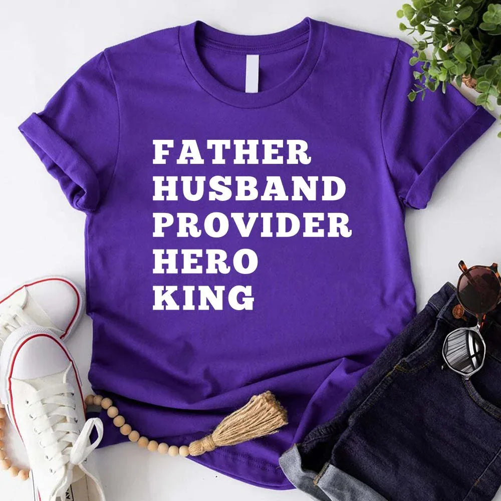 Purple crewneck T-shirt with stacked "FATHER HUSBAND PROVIDER HERO KING" print