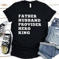 Black crewneck T-shirt with stacked "FATHER HUSBAND PROVIDER HERO KING" print