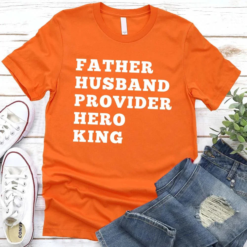 Orange crewneck T-shirt with stacked "FATHER HUSBAND PROVIDER HERO KING" print