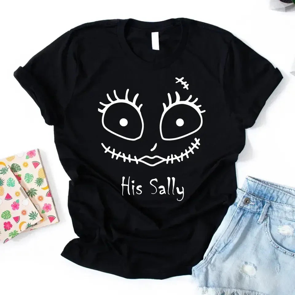 Black crewneck Halloween tee with stitched face graphic and text 'His Sally'.