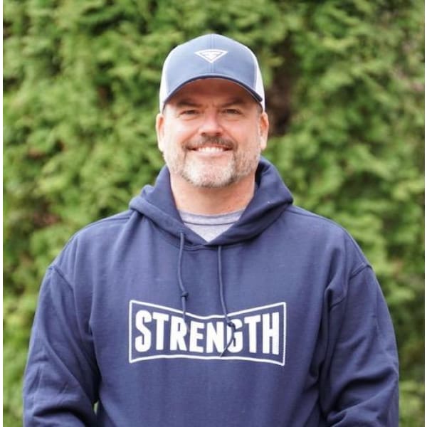Navy hoodie sweatshirt with 'STRENGTH' chest logo and drawstring hood