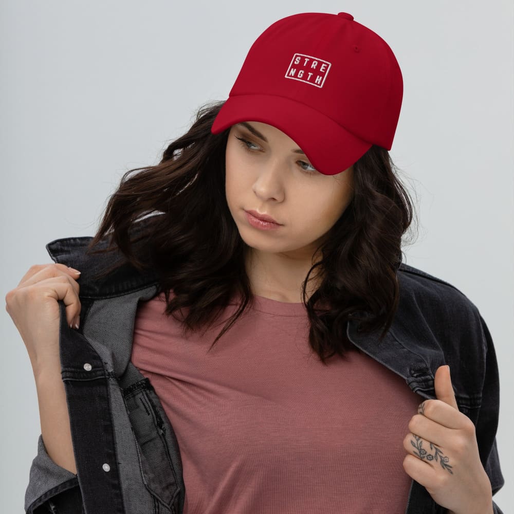 Red baseball cap with embroidered square logo on front
