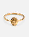 Gold-tone sunburst ring with raised round sunburst design on thin band