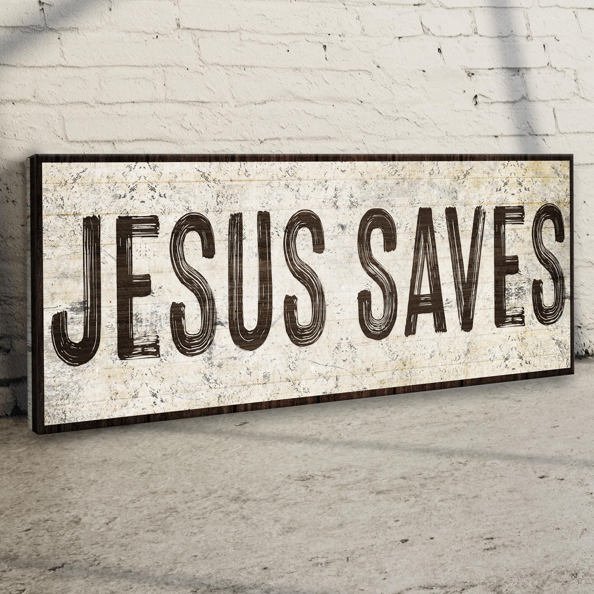 Wide distressed “JESUS SAVES!” wall sign with dark outer frame