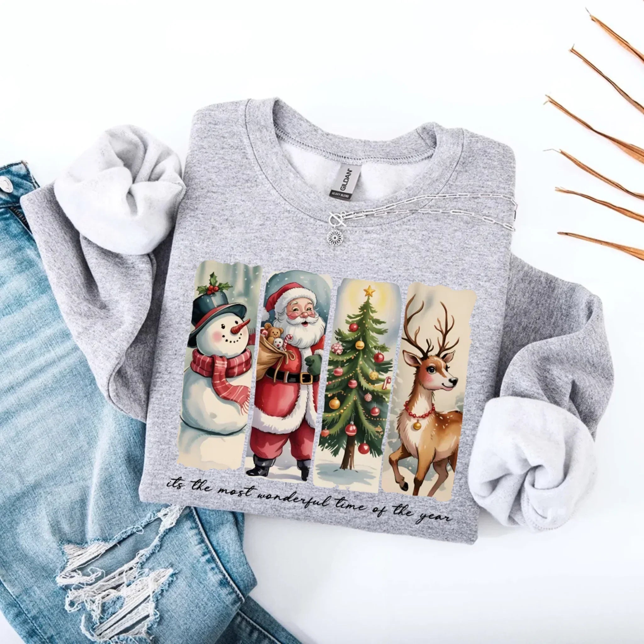 Light grey crewneck sweatshirt with Santa, snowman, tree and reindeer graphic