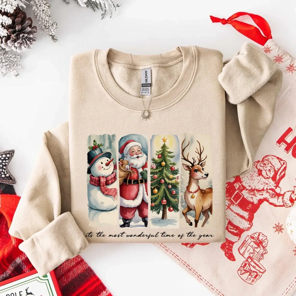 Crewneck sweatshirt in sand color with Santa, snowman, tree, and reindeer front graphic