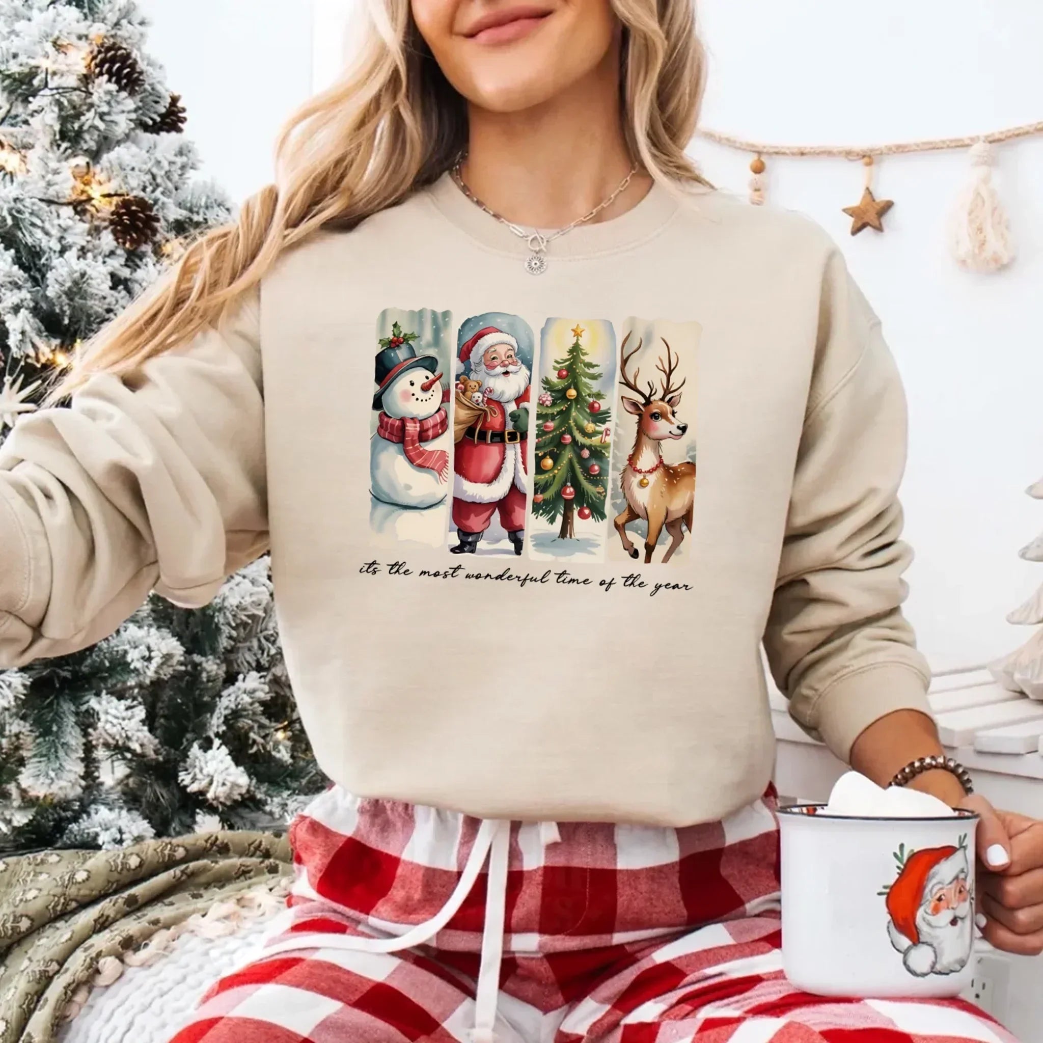 Cream crewneck sweatshirt with Santa, snowman, tree and reindeer graphic