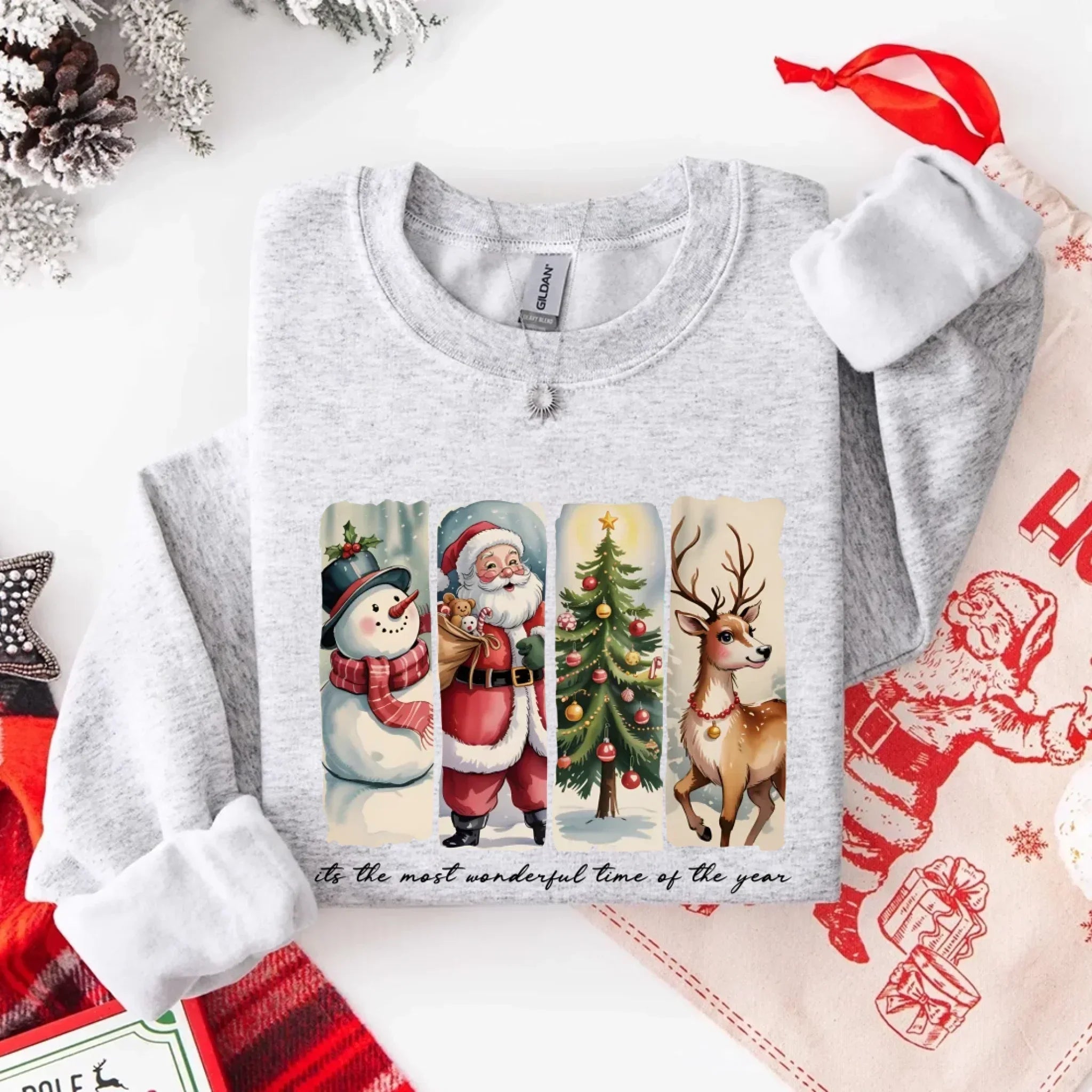 Grey crewneck sweatshirt with Santa, snowman, tree and reindeer graphic