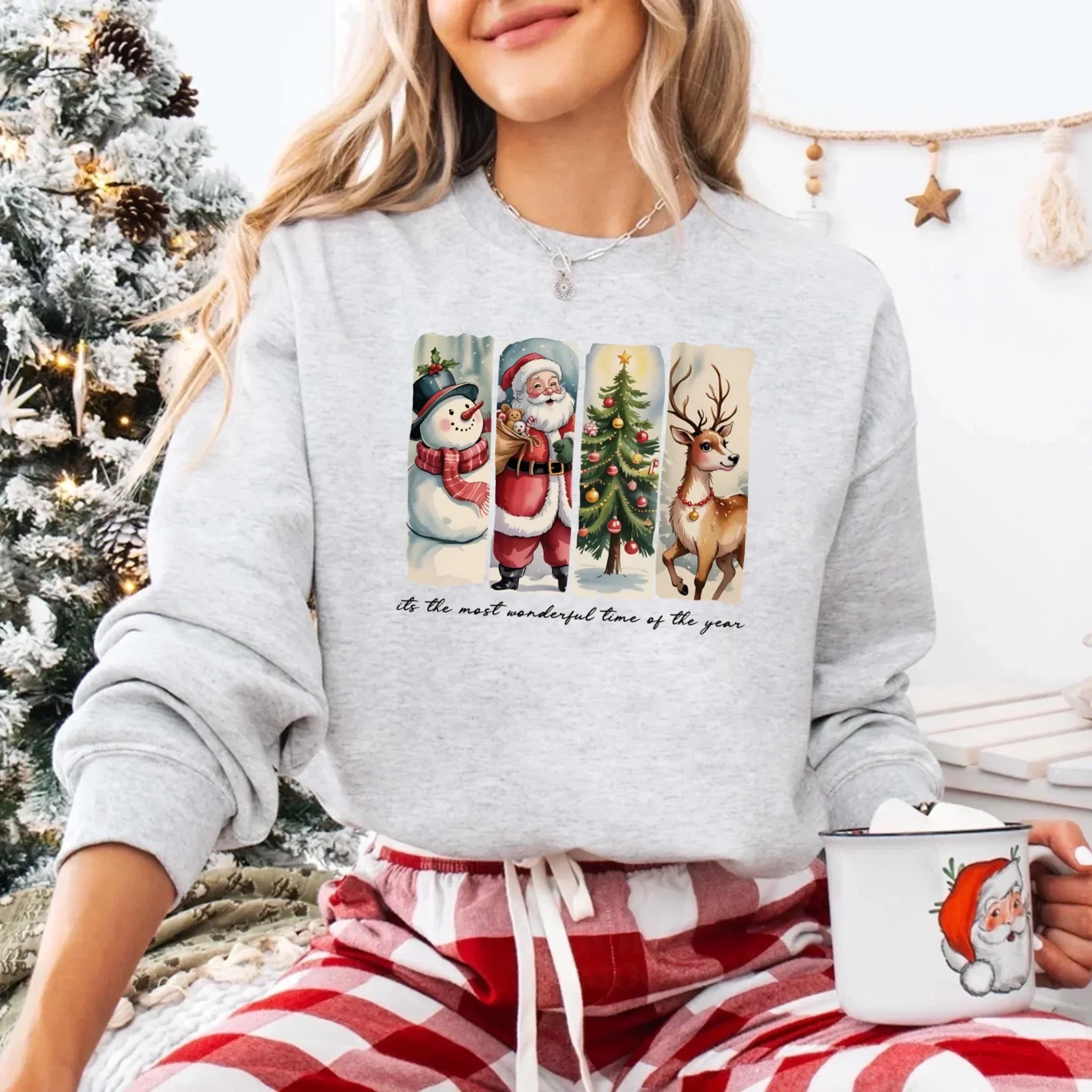 Light grey crewneck sweatshirt with Santa, snowman, tree and reindeer graphic