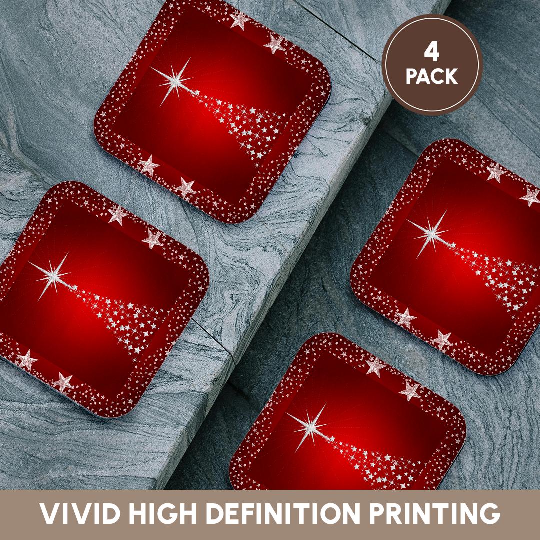 Four red holiday star tree coasters with silver sparkle star accents, on a gray surface