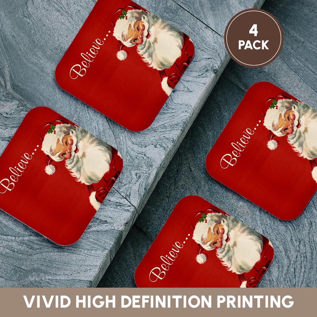 Set of 4 red coasters with vintage Santa and “Believe...” script, arranged on fabric