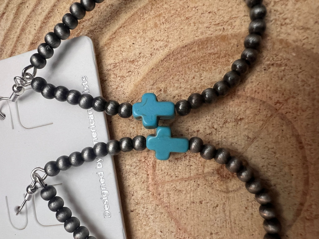 Close-up cross drop earrings with turquoise cross and black bead strands