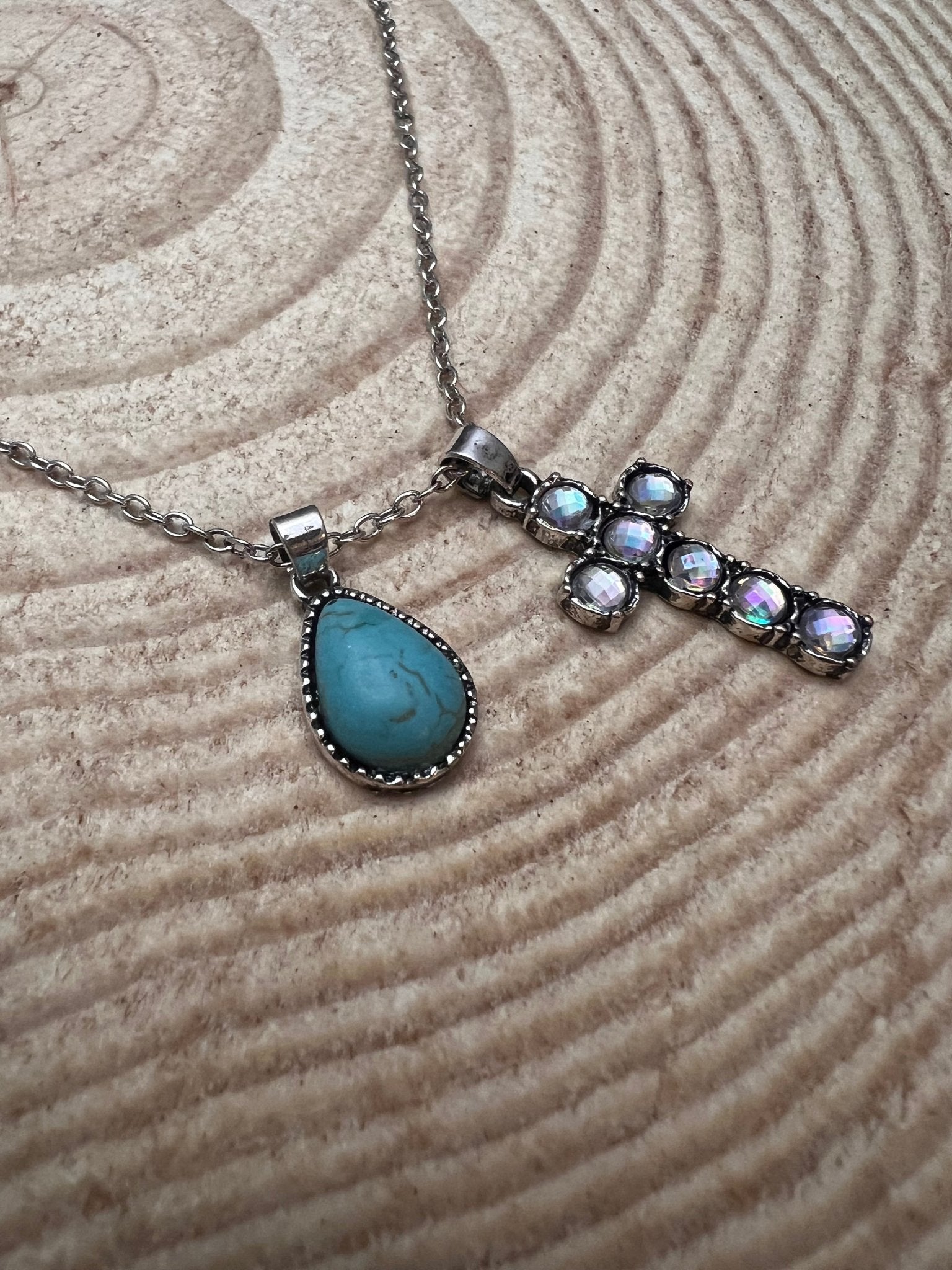 Silver rhinestone cross necklace with turquoise teardrop dangle pendant