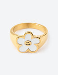 Gold smiley flower ring with white enamel petals and smiling face