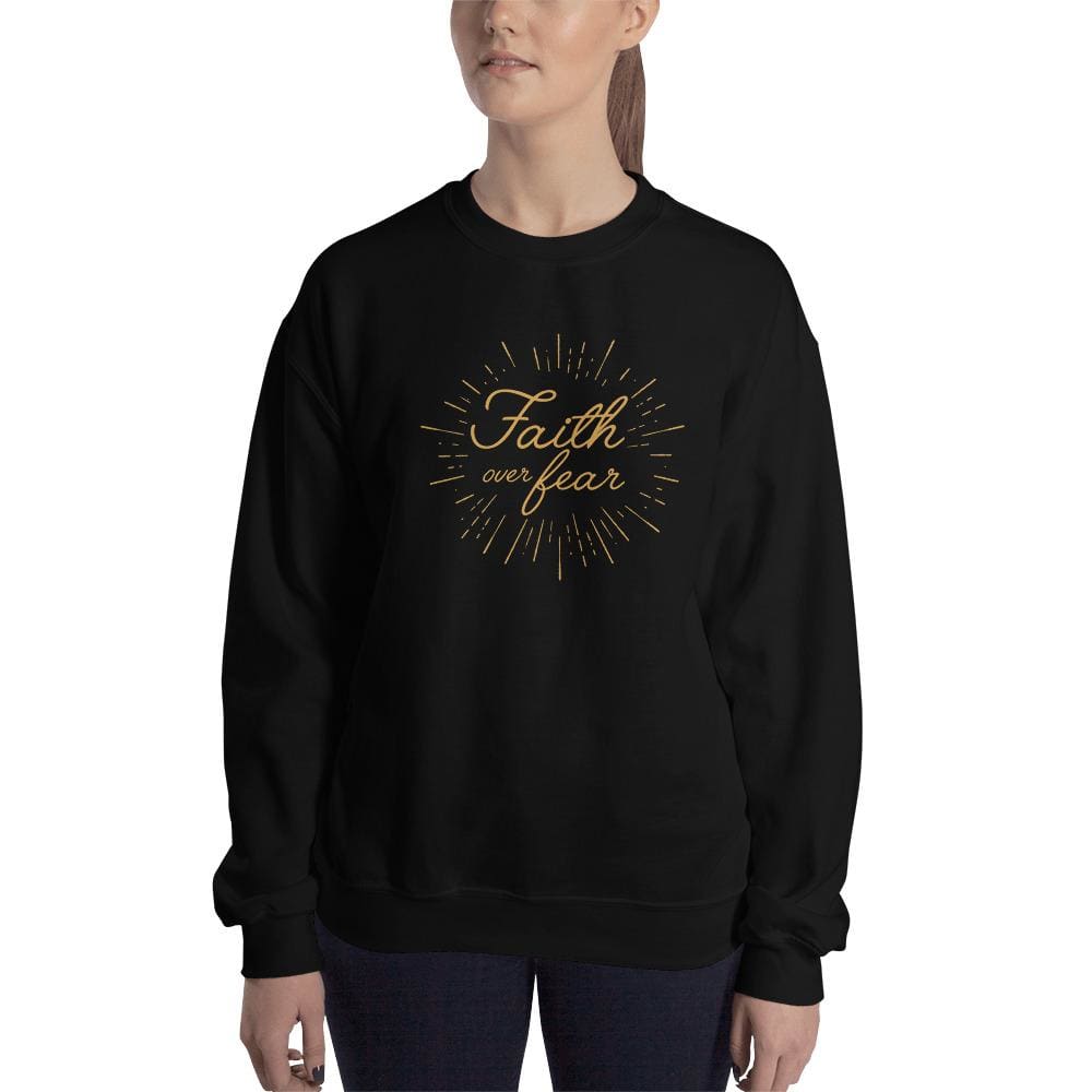 Women's crewneck sweatshirt in black with gold 'Faith over fear' chest graphic.