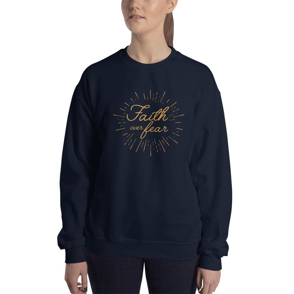 Women's crewneck sweatshirt in dark navy with gold 'Faith over fear' chest graphic.