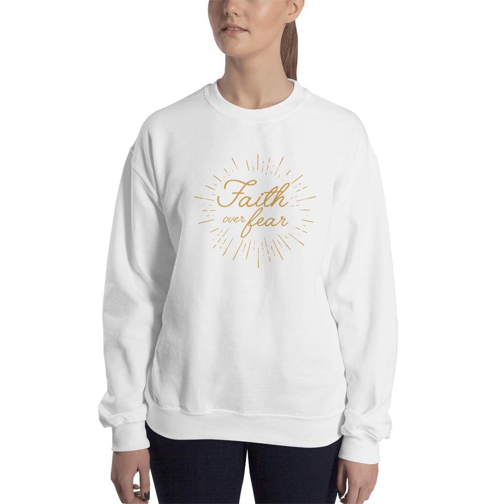 Women's crewneck sweatshirt in white with gold 'Faith over fear' chest graphic.