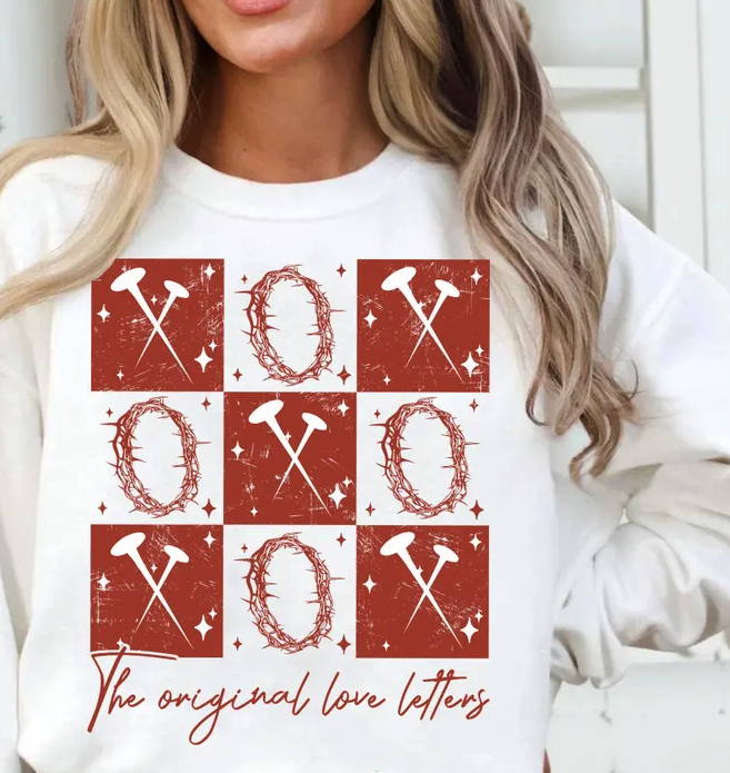 White crewneck sweatshirt with red XO and 'The original love letters' front graphic