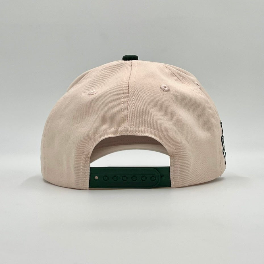 Cream snapback cap with green adjustable band and curved brim