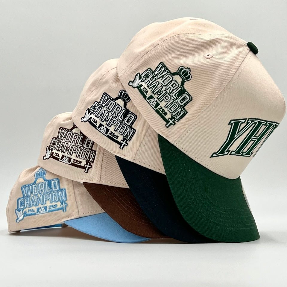Cream and green snapback cap with World Champion graphic patches on side
