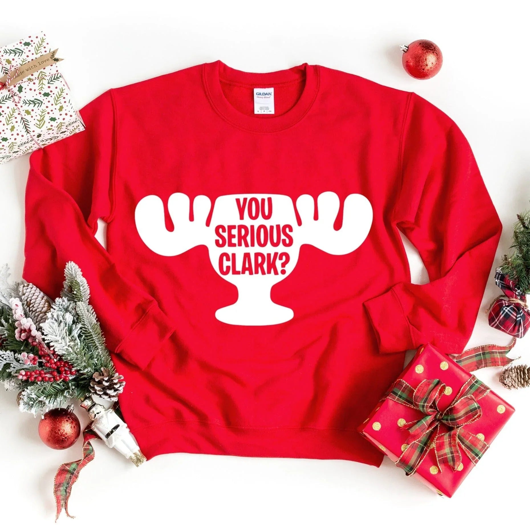 Red crewneck sweatshirt with white 'You Serious Clark?' graphic